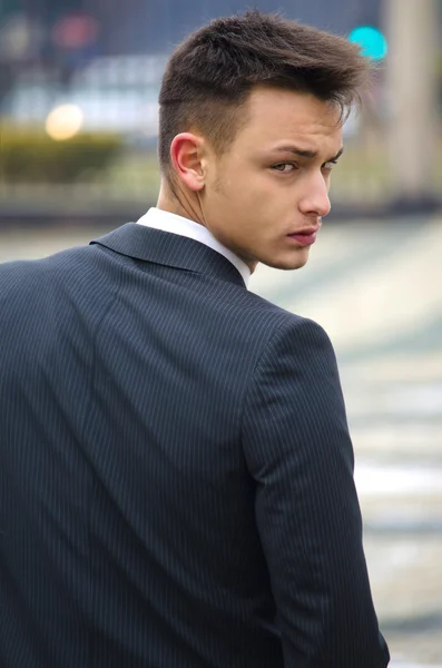 Good looking young man in suit, back view — Stock Photo, Image