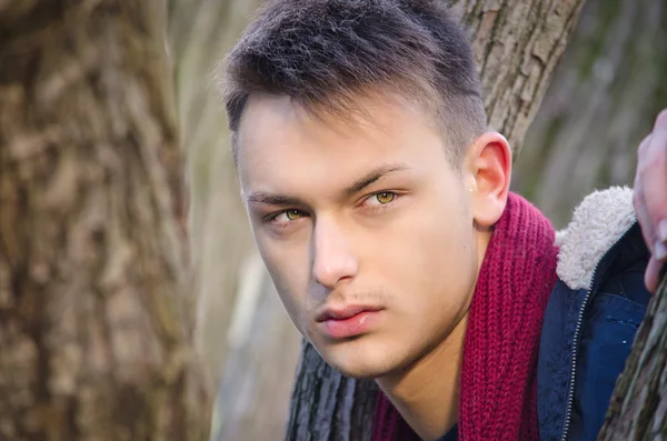 Close-up of attractive young man outdoors in nature — Stok Foto
