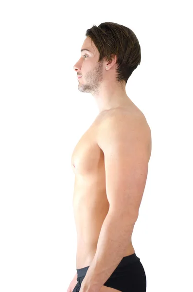 Shirtless young man showing proper standing position or posture — Stock Photo, Image