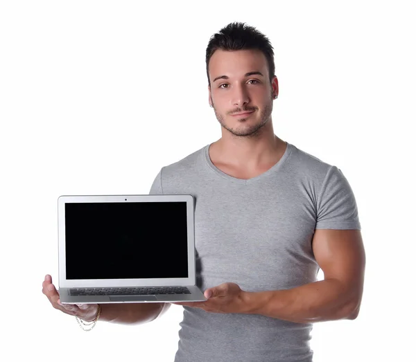 Handsome young man showing laptop computer — Stock Photo, Image