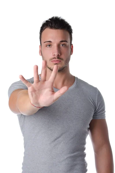 Young man doing stop gesture with his hand — Stock Photo, Image