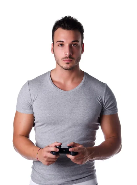 Красивый молодой человек, с помощью джойстика или джойстика для видеоигр — стоковое фото