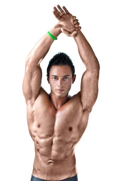 Handsome, muscular young man with arms stretched up – stockfoto