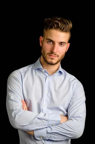 Studio portrait of handsome young businessman looking in camera — Stock Photo, Image