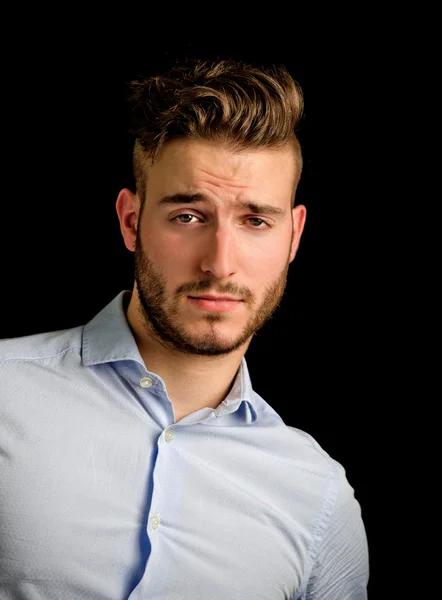 Handsome young man portrait with doubtful, unsure expression — Stock Photo, Image