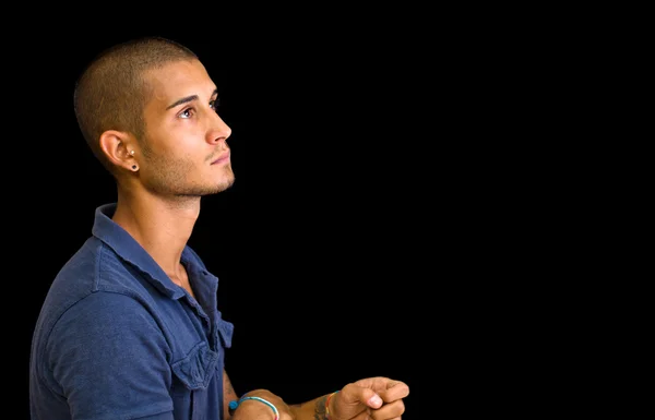 Attractive young man, profile view, looking up — Stock Photo, Image