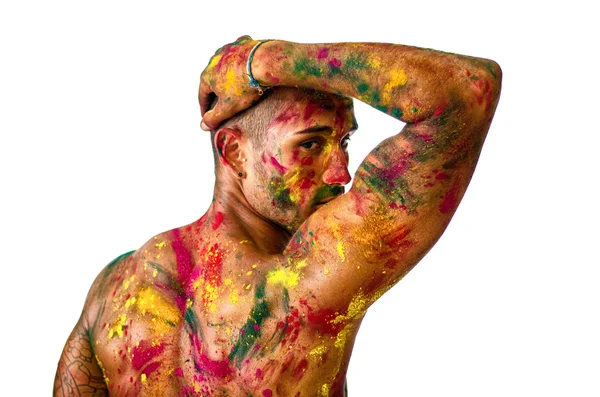 Handsome young man with skin all painted with colors, seen from back — Stock Photo, Image