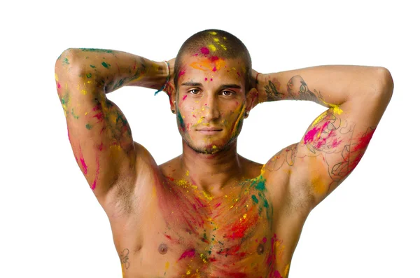 Attractive young man shirtless, skin painted all over with bright colors — Stock Photo, Image