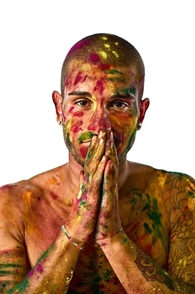 Hübscher junger Mann mit Haut alles bemalt mit Farben, Hände in f — Stockfoto