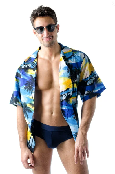 Handsome, athletic young man with open shirt and swimming suit — Stock Photo, Image