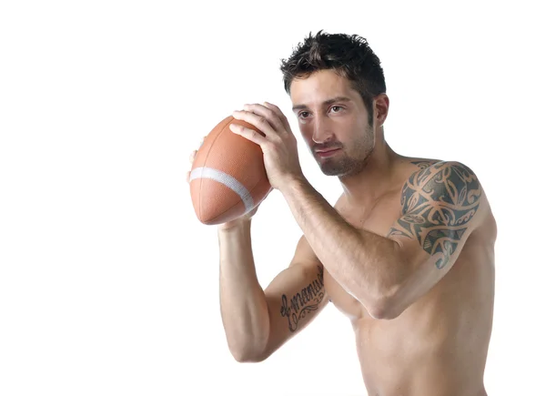 Handsome shirtless young man holding american football ball — Stock Photo, Image