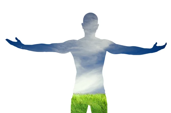 Inverse silhouette of man on green grass and blue sky — Stock Photo, Image