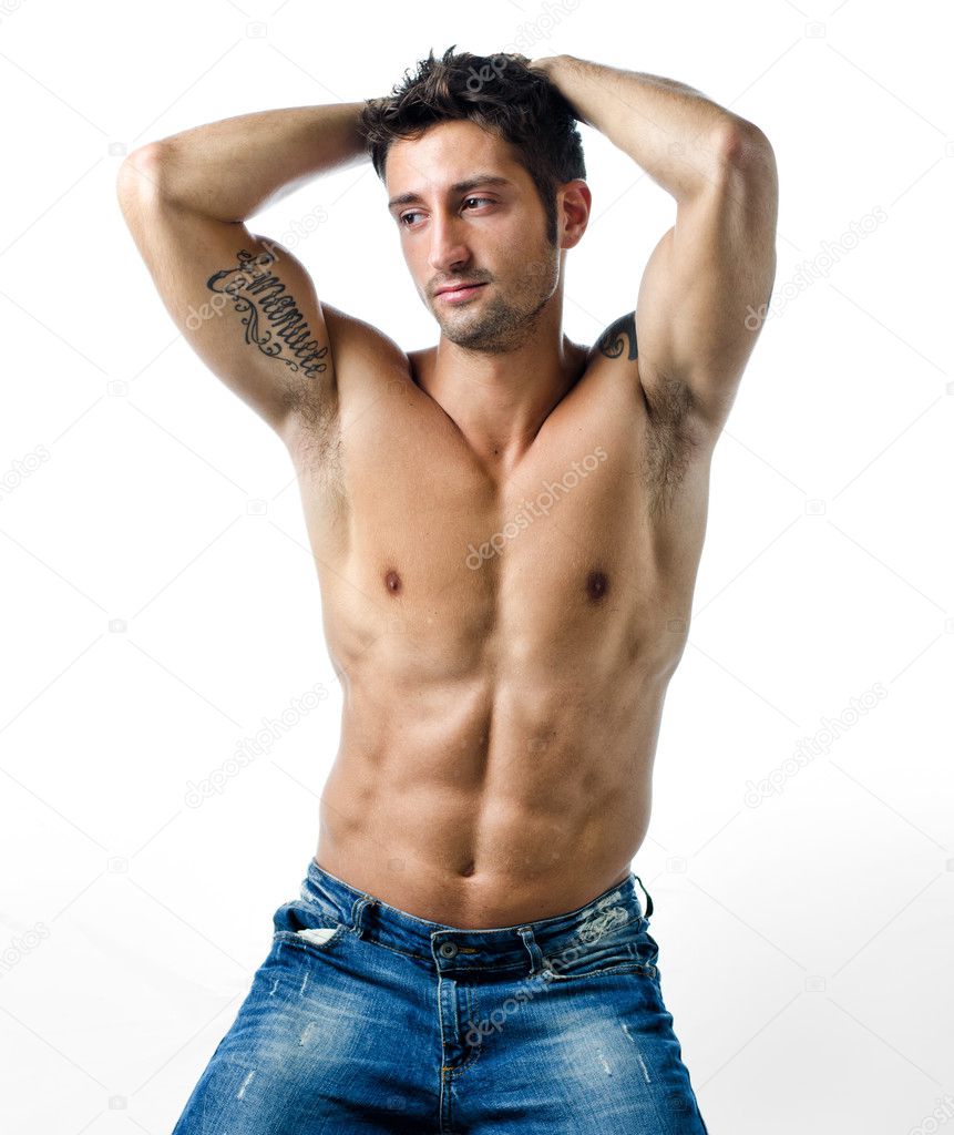 Handsome and fit young man shirtless with hands behind his head