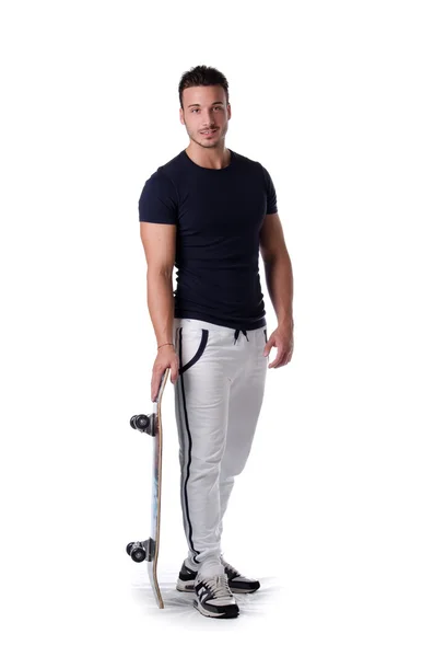 Full figure shot of young man with skateboard, isolated on white — kuvapankkivalokuva