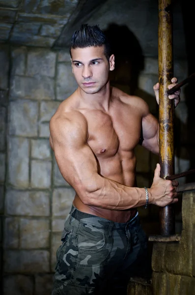 Handsome muscleman shirtless wearing military pants — Stock Photo, Image