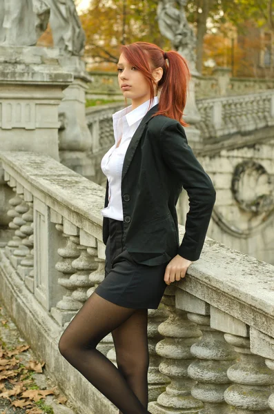 Pretty young woman in business attire outdoors — Stock Photo, Image