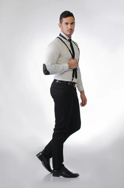 Elegant and stylish young man in studio shot, full figure — Stock Photo, Image