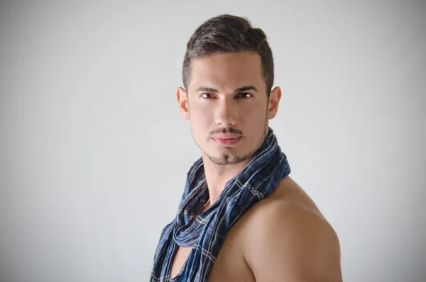 Portrait of handsome young man shirtless with blue scarf — Stock Photo, Image