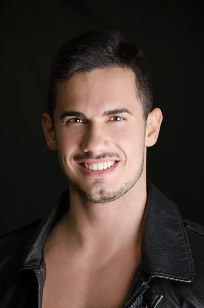 Portrait of attractive young man shirtless with leather jacket — Stock Photo, Image