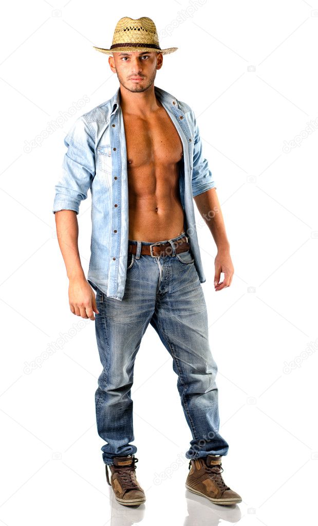 Handsome young man in jeans with straw hat