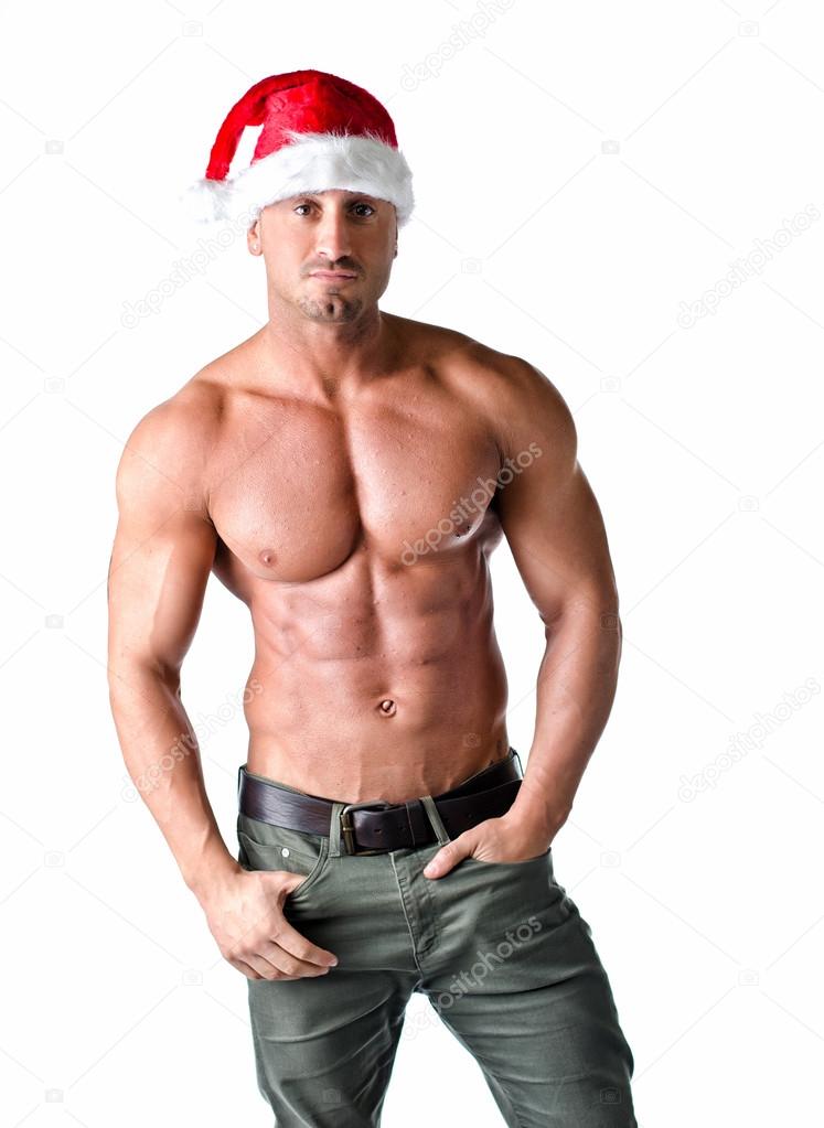 Muscular shirtless man with Santa Claus red hat