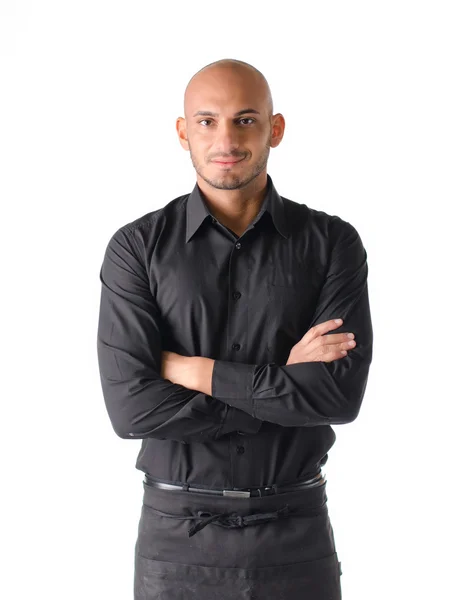 Young restaurant or bar waiter, standing on white, arms crossed — Stock Photo, Image