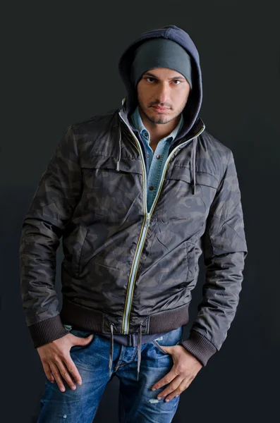 Trendy young man in winter clothes, studio shot — Stock Photo, Image