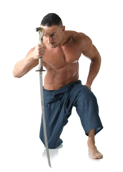 Muscular man kneeling on the floor shirtless, with japanese sword — Stock Photo, Image