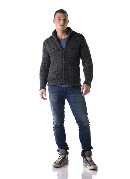 Full body shot of attractive young man with wool sweater and jeans — Stock Photo, Image