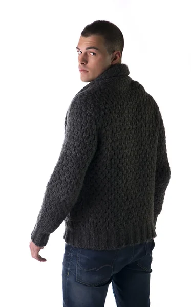 Vista posterior de joven con suéter de lana y pantalones vaqueros — Foto de Stock
