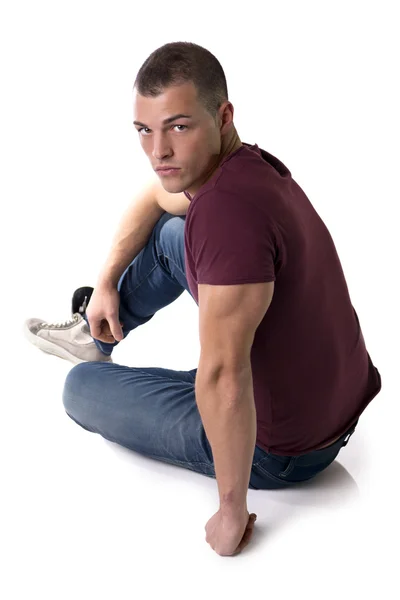 Full body shot of handsome young man sitting on floor — Stock Photo, Image