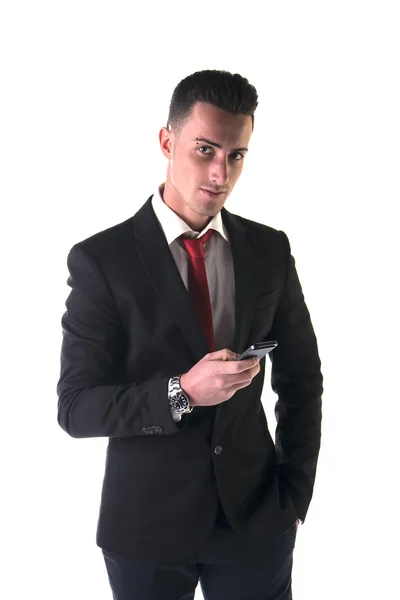 魅力的な若いビジネスマンのテキスト メッセージの携帯電話で — ストック写真