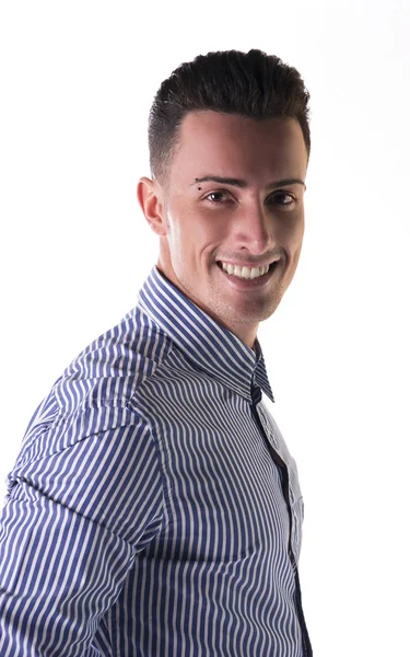 Smiling young man in striped shirt, looking at camera — Stock Photo, Image