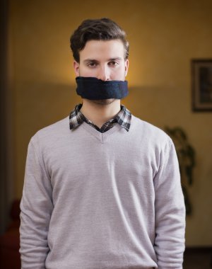 Gagged young man cannot speak clipart