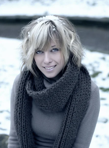 Attractive blonde young woman with wool scarf — Stock Photo, Image