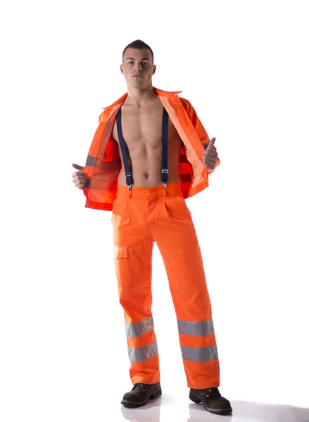 Full body shot of athletic young construction worker with open suit — Stock Photo, Image