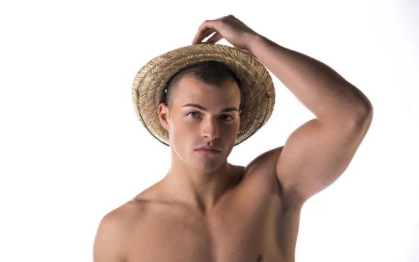 Shirtless attractive young man with straw hat — Stok Foto