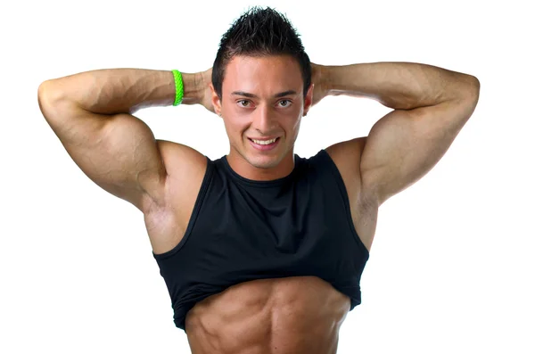Muscular joven culturista mostrando bíceps y abdominales rasgados —  Fotos de Stock