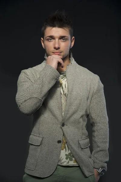 Handsome young man with wool jacket standing — Stock Photo, Image