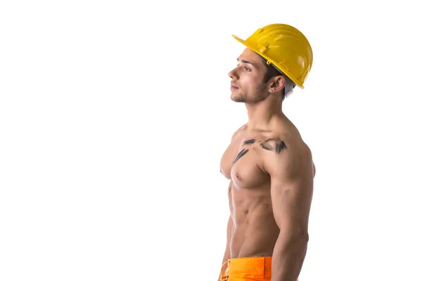 Vista di profilo di operaio della costruzione giovane muscoloso torso nudo — Foto Stock