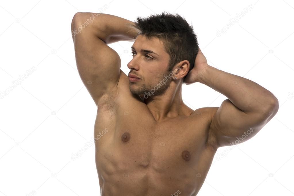 Attractive young muscle man showing athletic torso and biceps