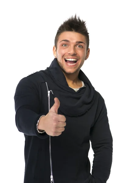 Atractivo joven feliz sonriendo, haciendo el pulgar hacia arriba signo — Foto de Stock