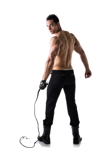 Muscular joven semidesnudo con látigo y guantes con tachas —  Fotos de Stock