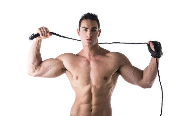 Muscular shirtless young man with whip and studded glove — Stock Photo, Image