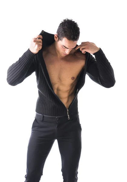 Confident, attractive young man with open sweater on muscular torso — Stock Photo, Image