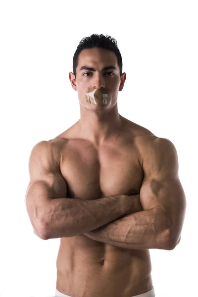 Muscular shirtless young man with duct tape on mouth cannot speak — Stock Photo, Image