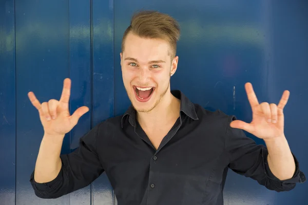 Happy handsome young man screaming — Stock Photo, Image