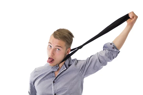 Funny young man hanging himself with neck-tie — Stock Photo, Image