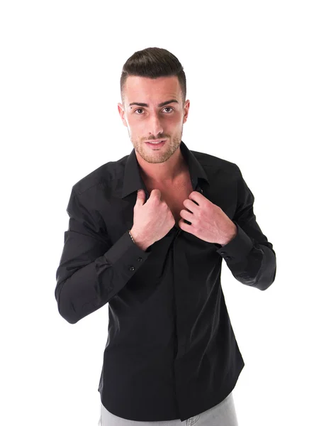 Smiling young man in black shirt, looking at camera — Stock Photo, Image