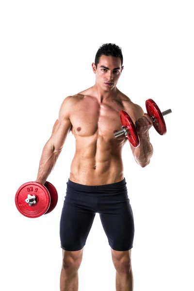Spierloze jongeman die biceps traint met halters — Stockfoto